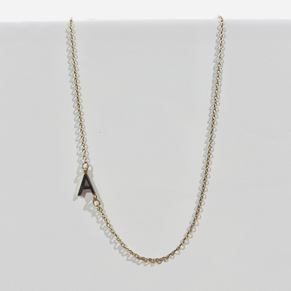 “Delicate” gold initial pendant