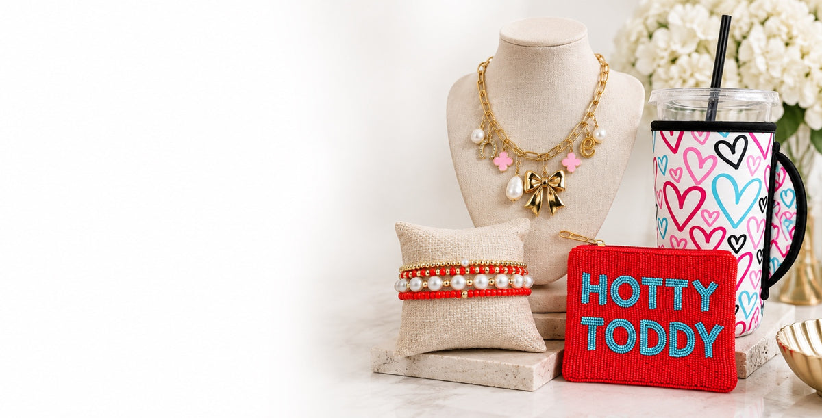 Calissippiana homepage hero featuring jewelry, koozie, bracelet stack, and beaded Hotty Toddy coin purse