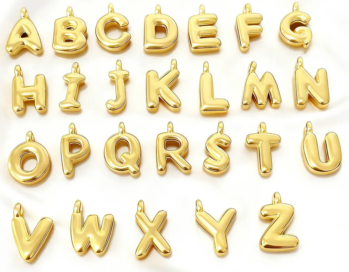 Gold puffy initial pendant charms, letters A through Z, on a white background